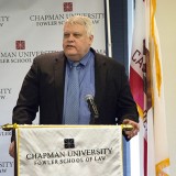 Thronson speaking at podium