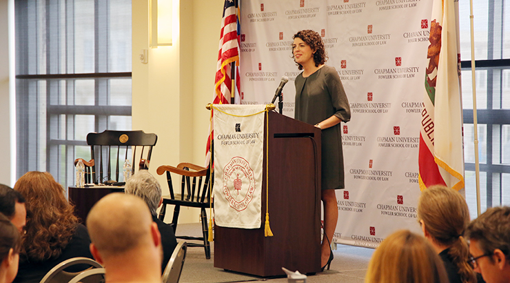 molly ball speaks at podium