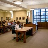 Two law students facing the bench in an appellate courtroom