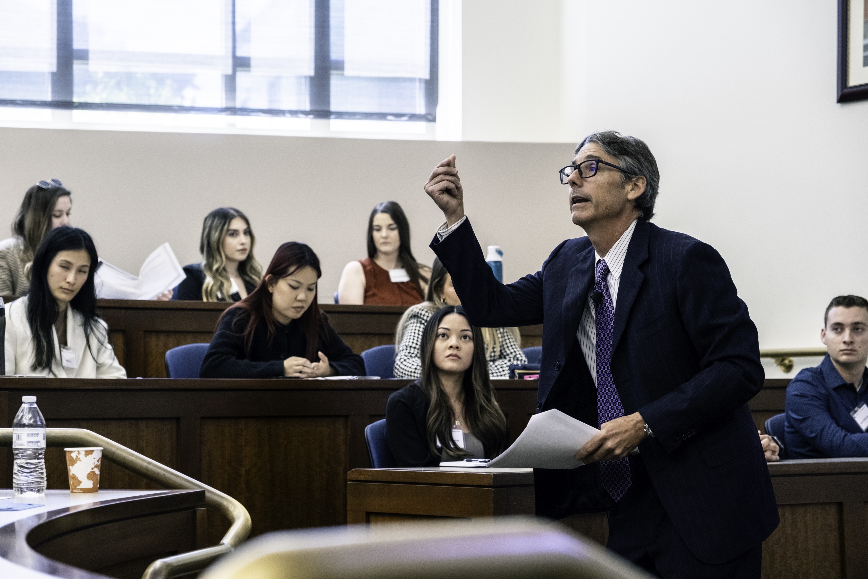 Photograph of a Chapman professor presenting a mock law class at Scholars Weekend