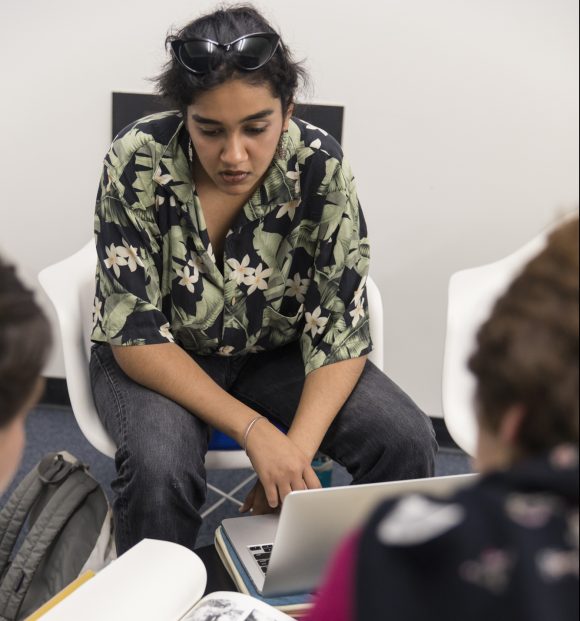 Kaur consulting with faculty mentor about research